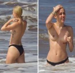 Miley Cyrus faz topless em praia no Havaí.